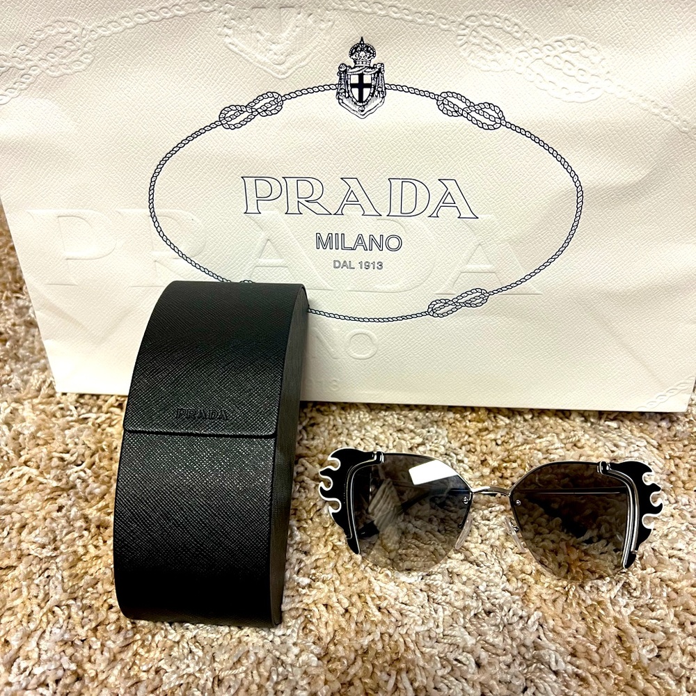 Authentic Prada Sunglasses in Pristine condition.